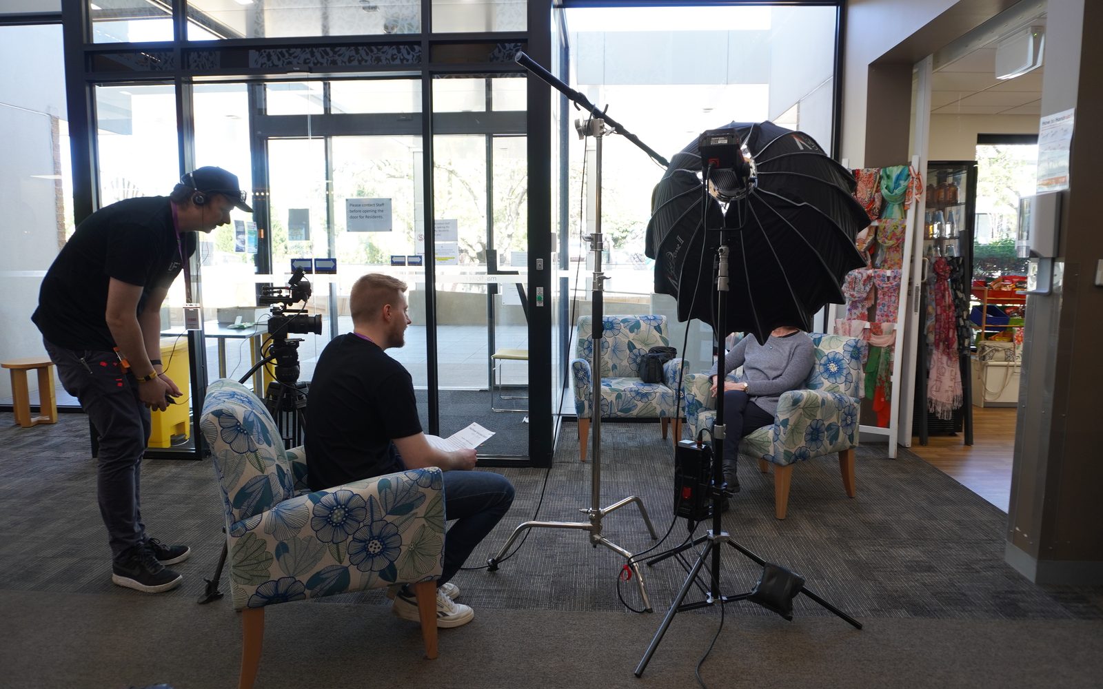 The Lift crew setting up a seated interview in an aged care home