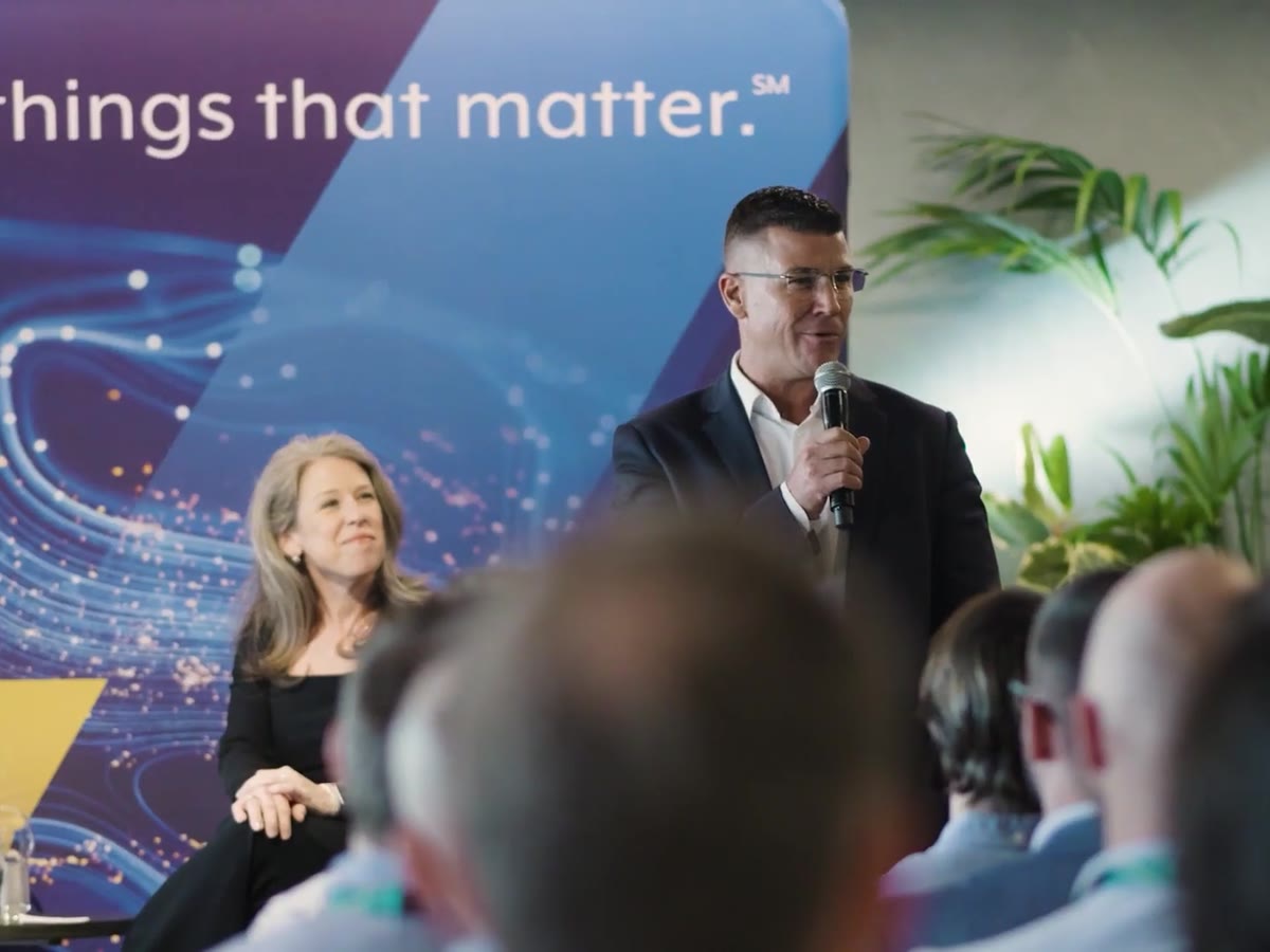 Two KBR leaders on stage answering questions at a staff event