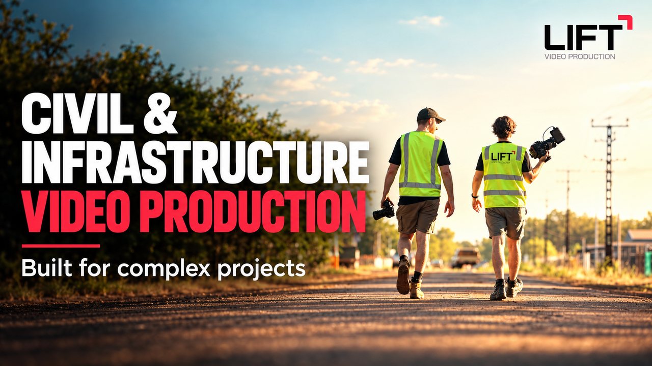 Two of the Lift crew in hi-vis vests carrying cameras along a gravel road, with the words Civil and infrastructure video production, built for complex projects